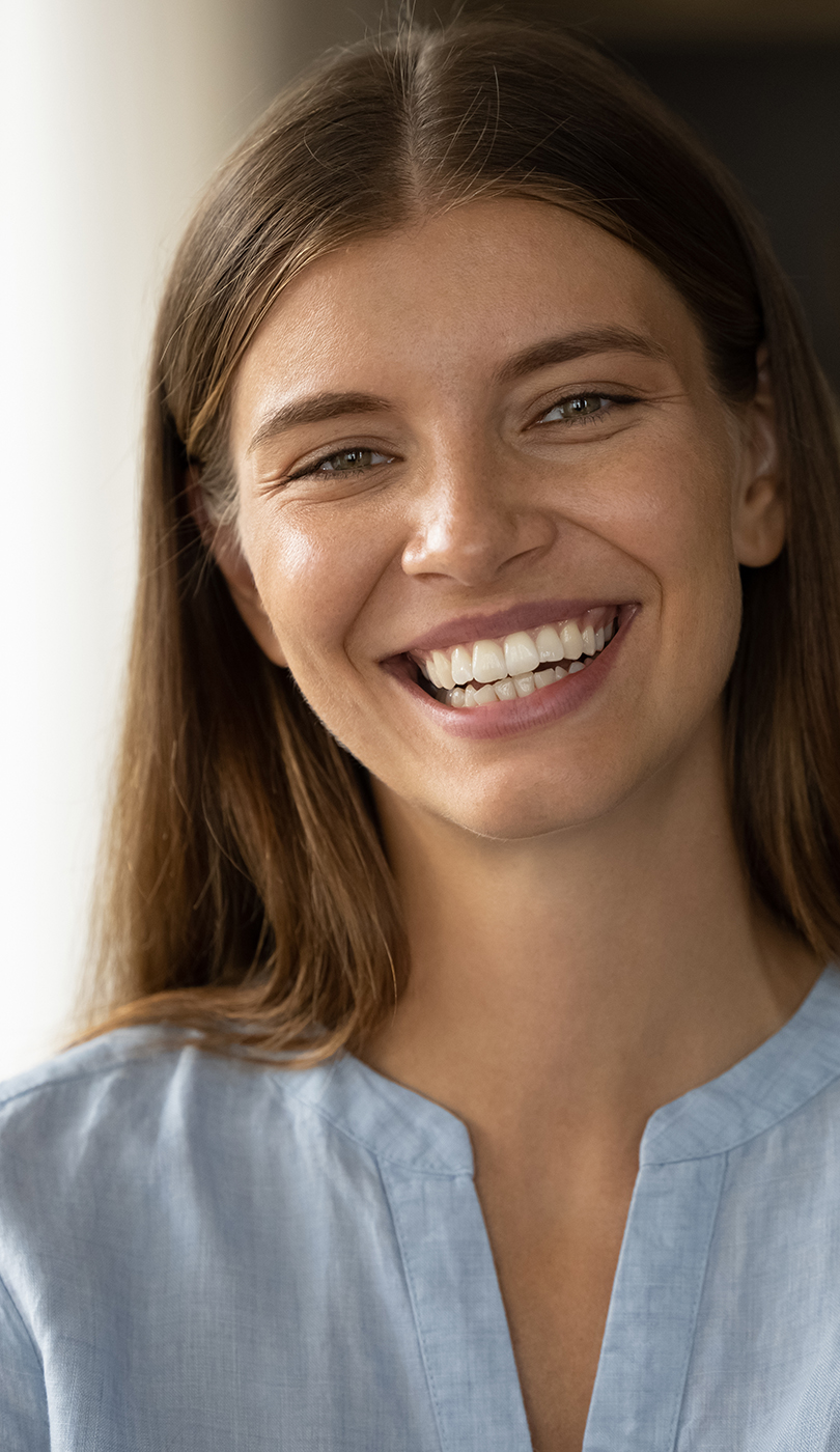 The image shows a modern dental or medical office interior with a dental chair, equipment, and a clean, professional environment.